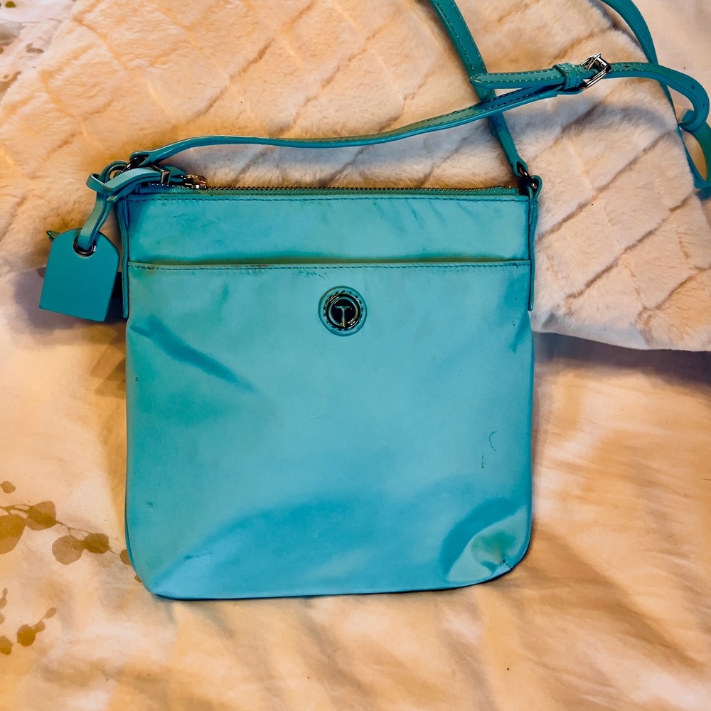 Talbots turquoise waterproof vinyl slim crossbody bag with long shoulder strap.